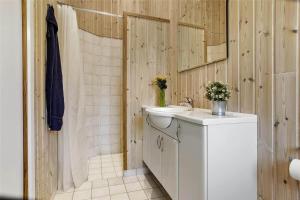 a bathroom with a white sink and a shower at 16623-Farevejle-Stihojvej-14 in Fårevejle +16 photos