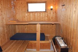 a inside of a wooden cabin with a window at 16626-Farevejle-Rormosen-56 in Fårevejle