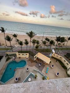 a view of a swimming pool and the beach at Caesar Towers Hotel by Asas Tur in Recife