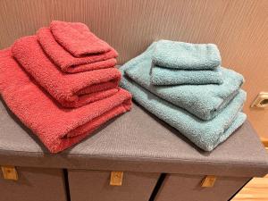 a pile of towels sitting on top of a table at Ferienwohnung Rhöner Luft in Bad Brückenau