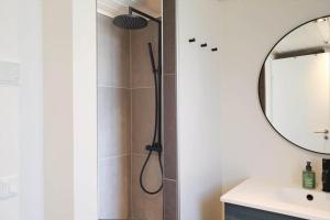 a bathroom with a shower with a shower head at 10045-1-Rorvig-Birkebakken-3 in Rørvig +19 photos
