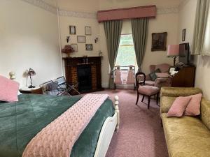 a bedroom with a bed and a living room at Penghana Bed and Breakfast in Queenstown