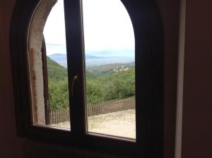 a window with a view of a mountain view at APPARTAMENTI Vista del Mondo in Spoleto