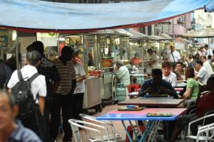 a crowd of people sitting at tables in a market at T-hotel JB in Johor Bahru
