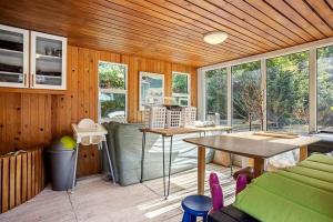 a room with a table and chairs in a room at LF14223-Roslev-Livovej-9 in Roslev