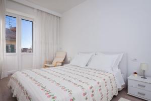 Postel nebo postele na pokoji v ubytování Apartment Vuko
