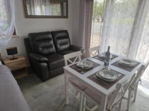 a living room with a table and a couch at Villa Müller in Poreč