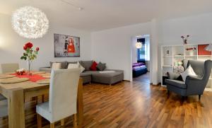 a living room with a table and a couch at Haus Daniela Superior in Cochem