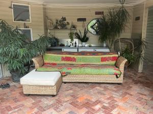 a living room with a couch and a table at Fremantle Local Beach Studio in Fremantle +31 photos