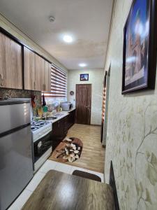 a kitchen with a table and a stove top oven at Апартаменты in Tashkent