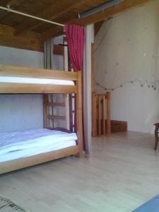 a bedroom with two bunk beds in a room at Jervl in Piriac-sur-Mer