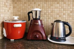 a blender and a toaster sitting on a counter at Sri Apartment Homestay 2BHK Pondicherry A2 in Pondicherry