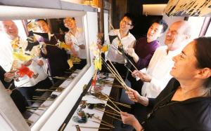 a group of people standing in a room with arrows at Beijing Shichahai Shadow Art Performance Courtyard in Beijing