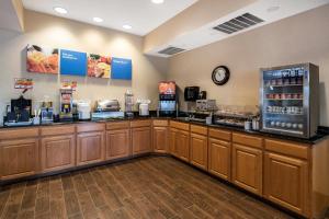 a coffee shop with a counter and a refrigerator at Comfort Inn & Suites Walla Walla in Walla Walla
