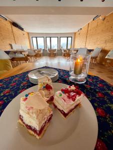 two pieces of cake on a plate on a table at Romanka in Żabnica