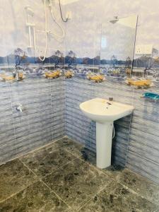 a bathroom with a white sink and a shower at Wishwa Villa in Weligama +41 photos