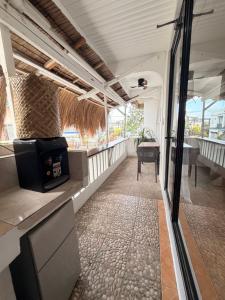 a view from the inside of a train room with a table at New Studio with Balcony , General Luna in General Luna