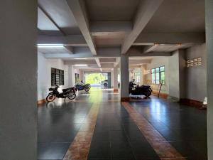a group of motorcycles parked in a building at Saan Stay in Ban Krabi Yai