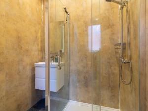 a bathroom with a glass shower with a sink at Grosvenor 126 Trendy Jesmond Whole Apartment in Jesmond +54 photos