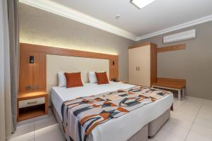 a bedroom with a large bed in a room at Villa Sunflower Hotel - All Inclusive in Alanya
