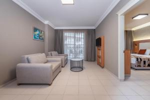 a living room with a couch and a bed at Villa Sunflower Hotel - All Inclusive in Alanya
