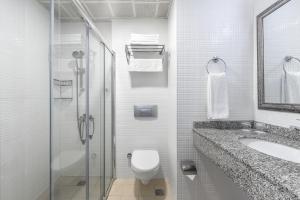 a bathroom with a toilet and a sink and a shower at Villa Sunflower Hotel - All Inclusive in Alanya +59 photos