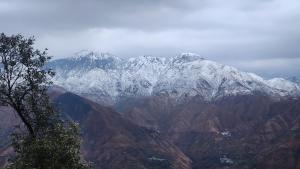 a view of a mountain with snow covered mountains at Krishna guest house in Mussoorie +2 photos