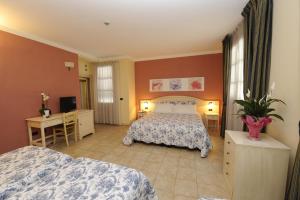 A bed or beds in a room at Hotel Sextum