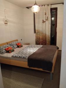 a bedroom with a bed and a shower at Planinski dom Kal in Dol pri Hrastniku