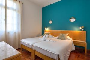 Postel nebo postele na pokoji v ubytování Hotel Monte Carlo