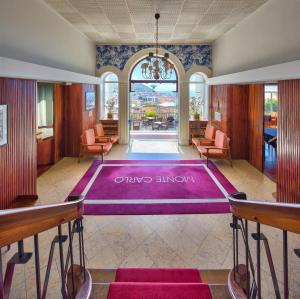 a large purple floor in the middle of a room at Hotel Monte Carlo in Funchal