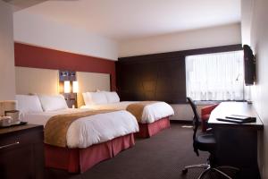 Ліжко або ліжка в номері Hotel Ruby Foo's