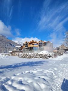 a house in the snow with a trail at PatRoch in Briançon