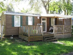 a small house with a porch and a deck at erick in Angles