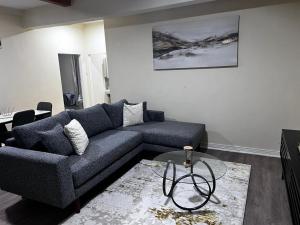 a living room with a couch and a table at 6ALouieVille in Lusaka