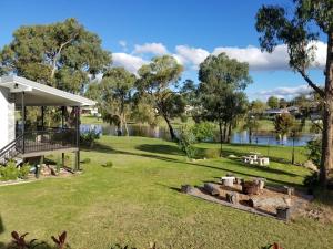 a backyard with a fire pit in the grass at Bella Vista Stanthorpe in Stanthorpe