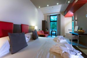 A bed or beds in a room at Hotel Parma & Congressi