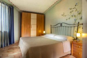 Katil atau katil-katil dalam bilik di Residence Verdeborgo