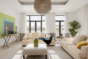 a living room with white furniture and a chandelier at Maison Privee - Villa on Beach with Private Pool The Palm Jumeirah in Dubai