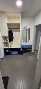 a room with a mirror and a dressing room at Apartmán Riverside Labe Vrchlabí in Vrchlabí