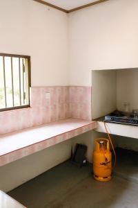 an empty room with a bench and a window at Green Serenity Villa in Ahangama
