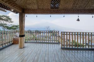 a view from the balcony of a house at RedDoorz at Omahku Guest House Batu in Malang