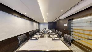 a long conference room with a long table and chairs at Radisson Blu Marina Hotel Connaught Place in New Delhi