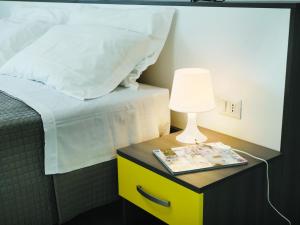 Postel nebo postele na pokoji v ubytování Residenze Parmensi