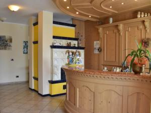 a kitchen with yellow and blue walls and a counter at Agritur Campo Fiorito in Dro