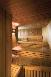 an empty sauna with a wooden at Hotel Reine Victoria in St. Moritz