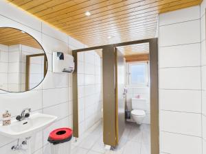 a bathroom with a sink and a toilet at Hotel Wildbach Brienz - Self Check-in in Brienz