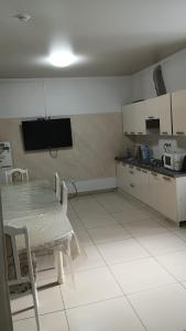 a kitchen with a table and chairs in a room at Гостиница"Hostel" in Karagandy +16 photos