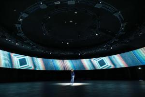 a person standing in front of a large stage at Quark Hotel Milano in Milan