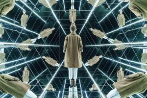 a man standing in front of a room filled with robots at Quark Hotel Milano in Milan
